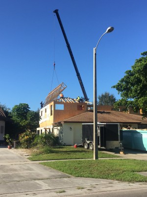 The crane putting on our roof trusses. Picture taken at 8:30 am.
